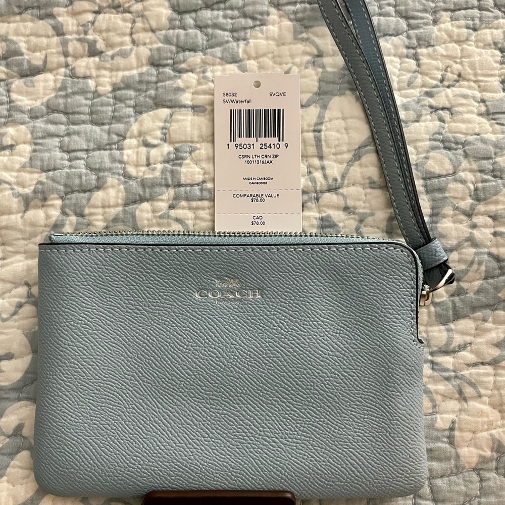 ***SOLD***Coach wristlet in waterfall color. Used maybe one.